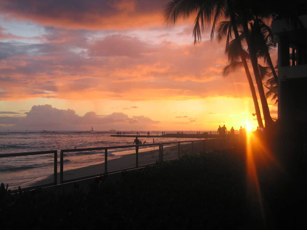 Sunset on Waikiki Beach in Honolulu, Hawaii.