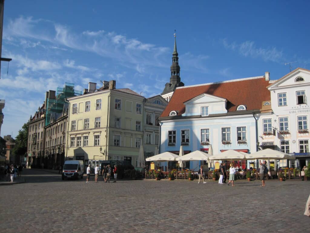 Town Square in Tallinn, Estonia on a summer day with blue sky and wispy white clouds.