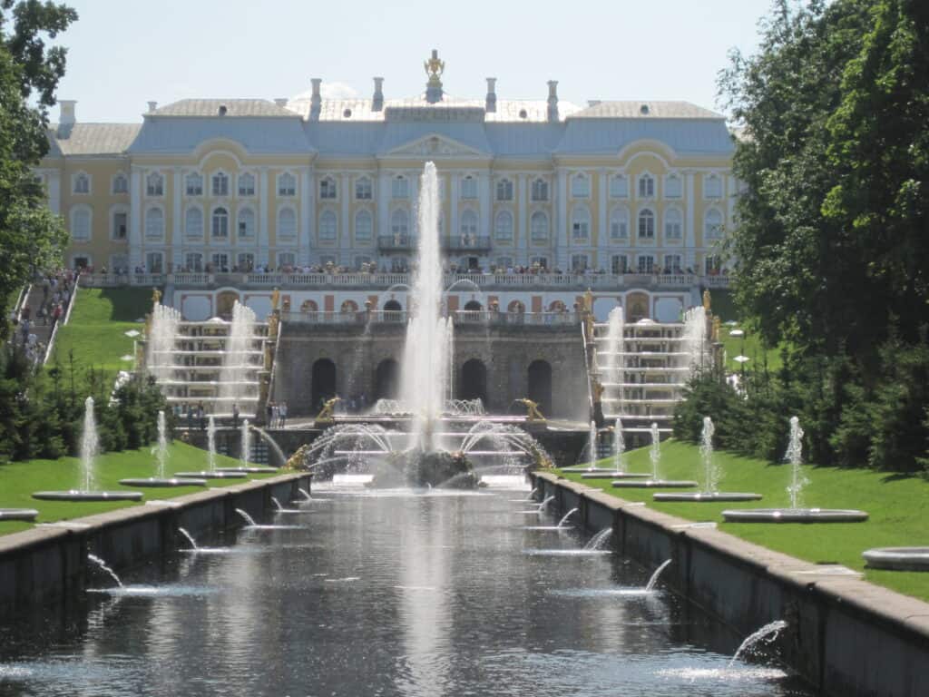 View of Peterhof Palace from the gardens - canal and Samson fountain.