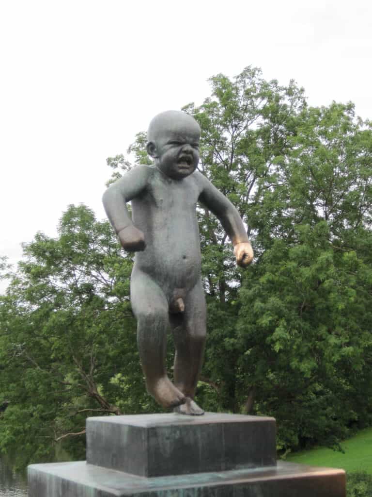 Statue of crying boy toddler in Vigeland Park, Oslo, Norway.