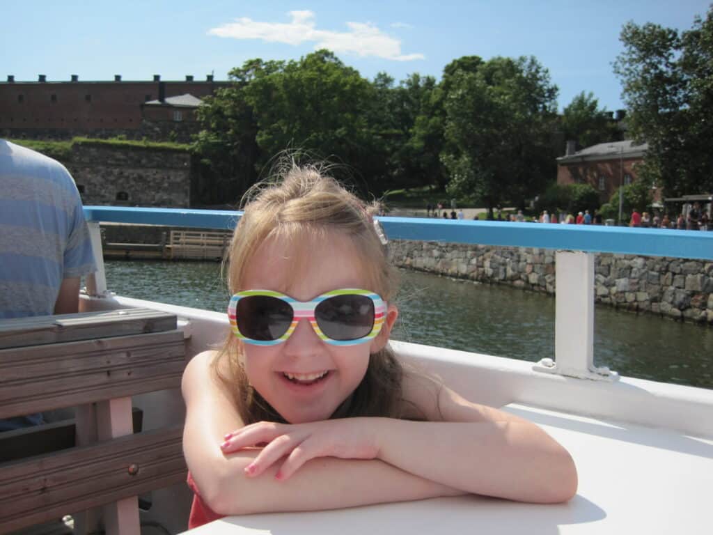 Young girl sitting on ferry to Suomenlinna in Helsinki.