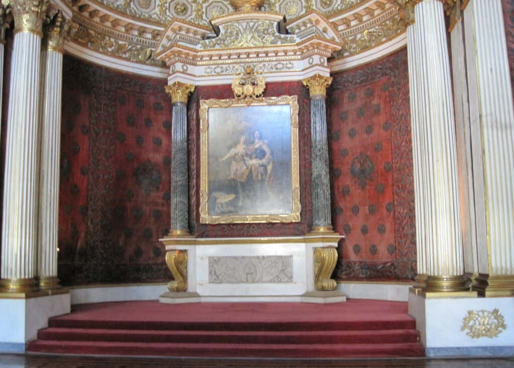 Painting on display in elaboorate setting inside the Hermitage.