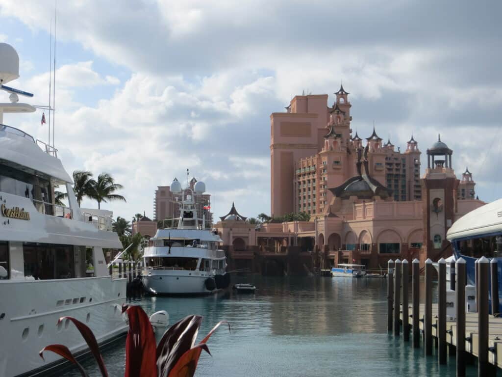 Yachts docked at the Marina at Atlantis with resort tower in background.