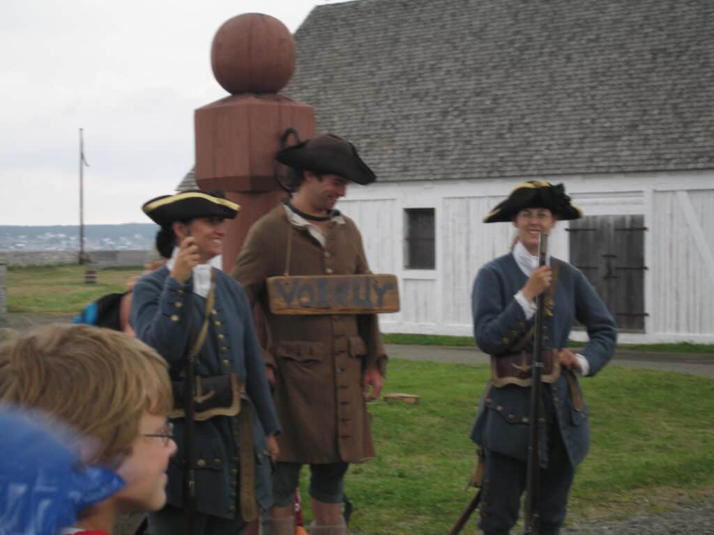 Costumed actors reenacting punishment of a thief at the Fortress of Louisbourg National Historic Site, Cape Breton Island.