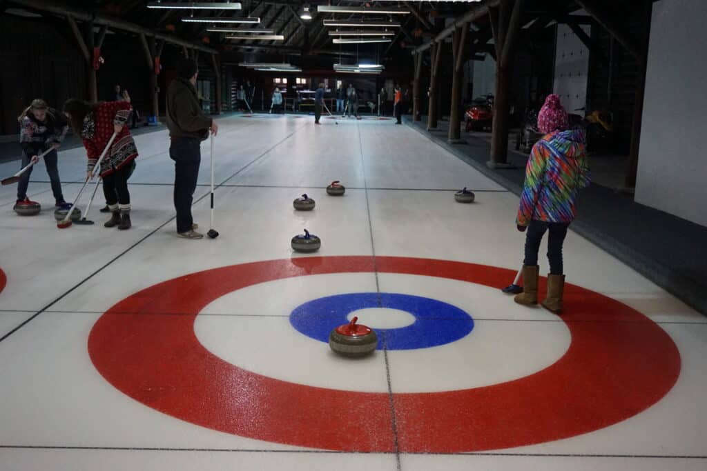 several people on curling rink at the fairmont chateau montebello