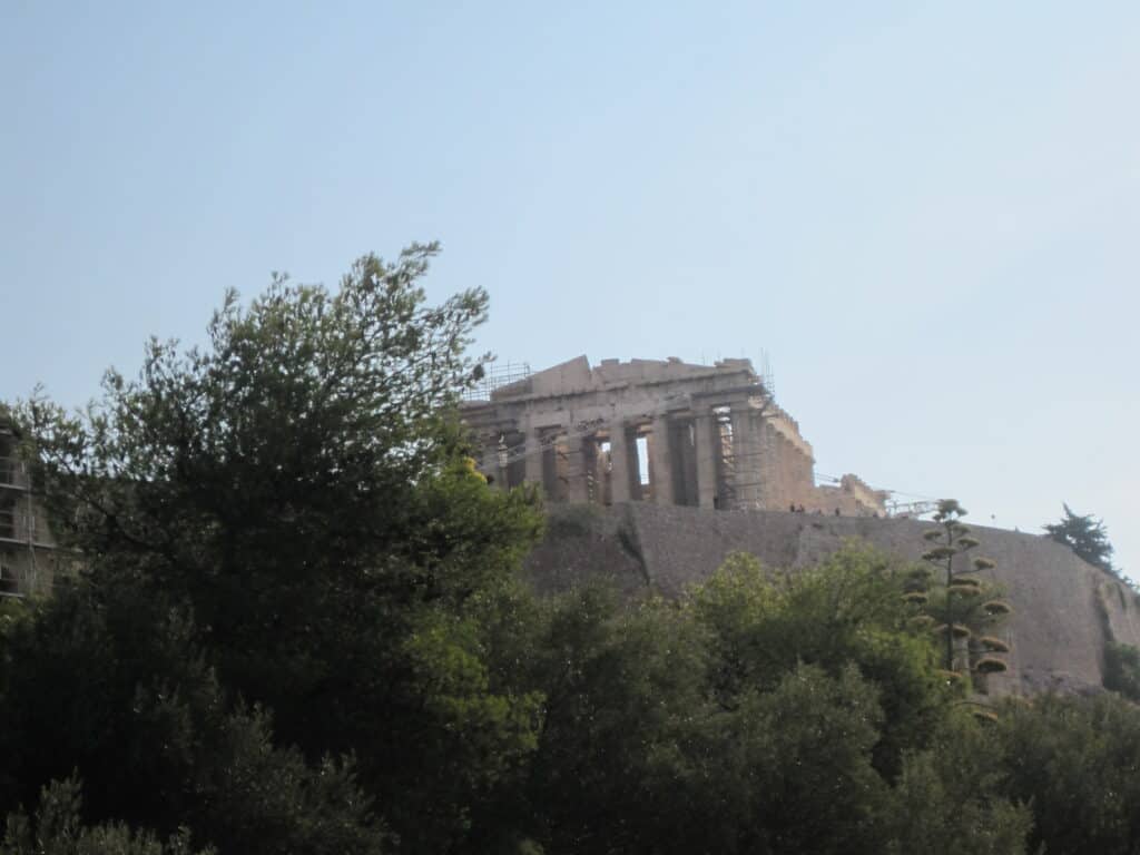 Parthenon temple on the Acropolis in Athens, Greece viewed from a distance.