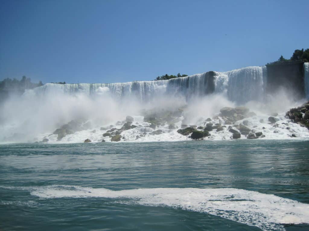 niagara falls american side on summer day with blue cloudless sky.