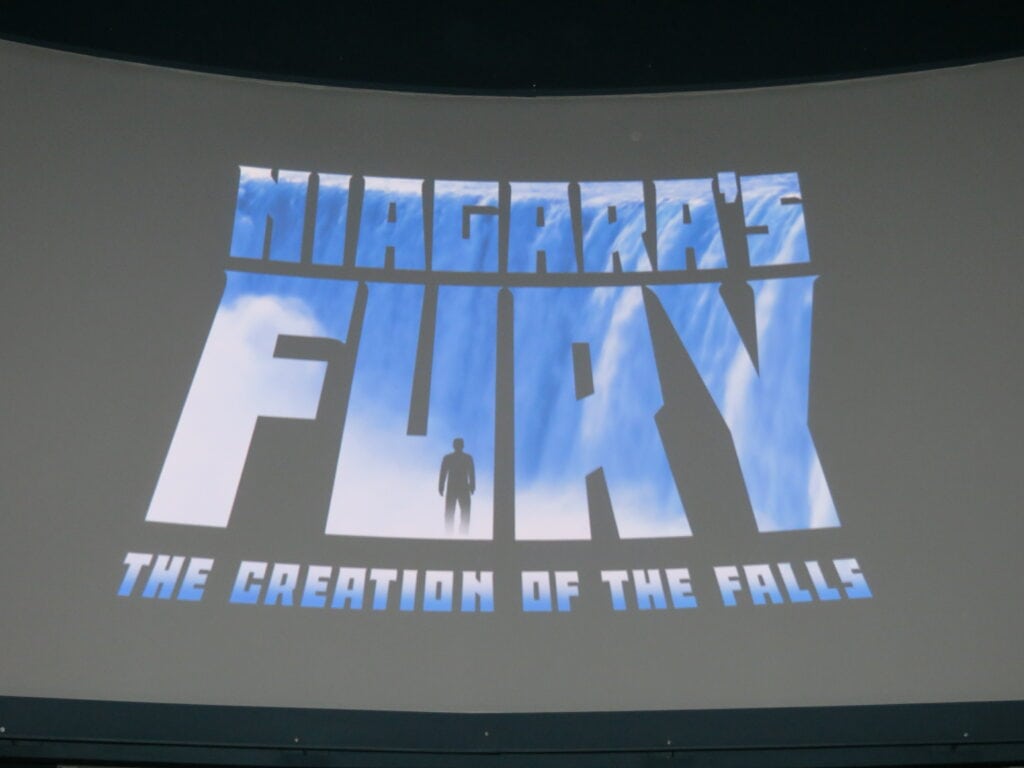 Niagara's Fury: The Creation of the Falls projected on a screen.