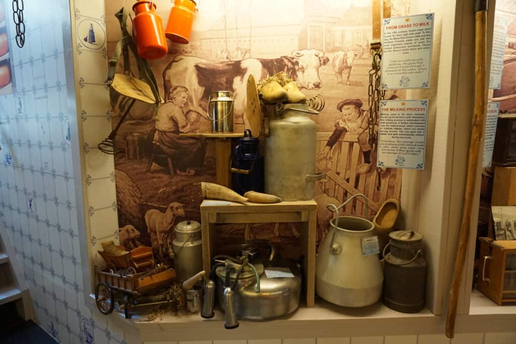 Display of cheese making equipment at Amsterdam Cheese Museum.