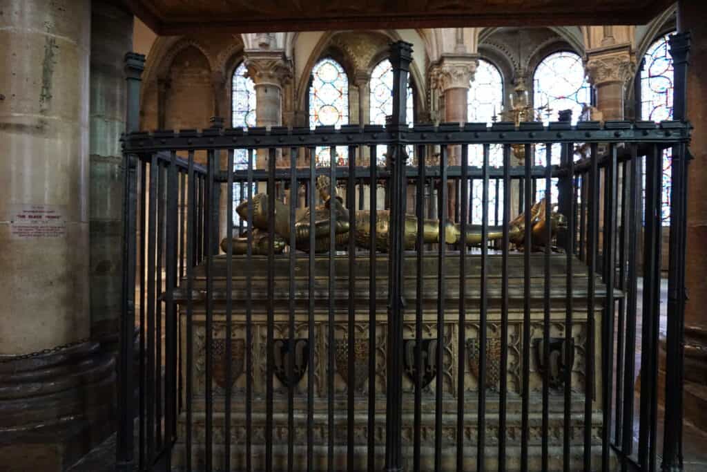 Tomb of the Black Prince behind wrought iron gating at Canterbury Cathedral in England.