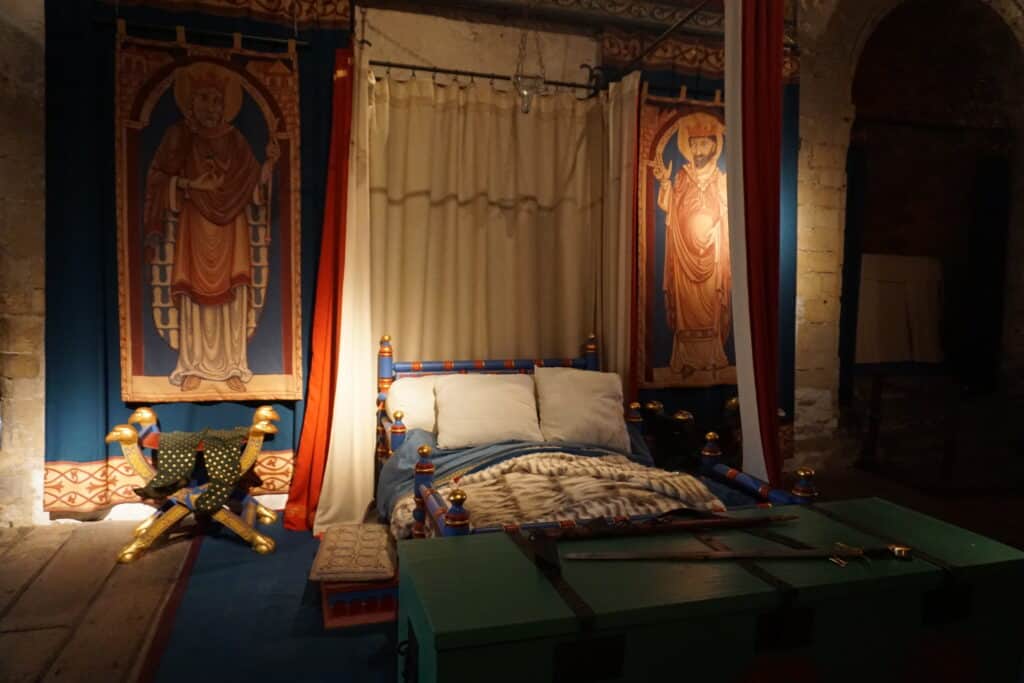 King's Chamber at Dover Castle - furnished and decorated for time period in mostly blues, reds and golds.