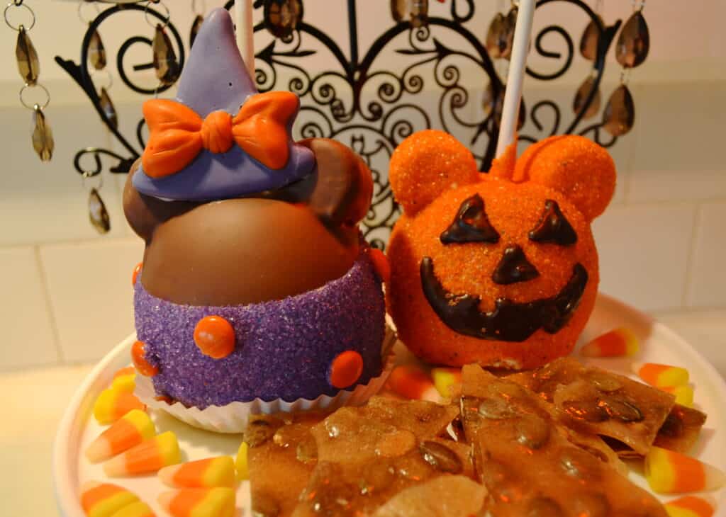 Halloween decorated candy apples on a display plate at Disneyland.