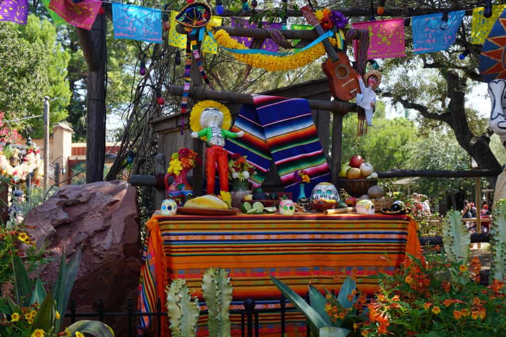 Colourful Dia de los Muertos display table at Disneyland.