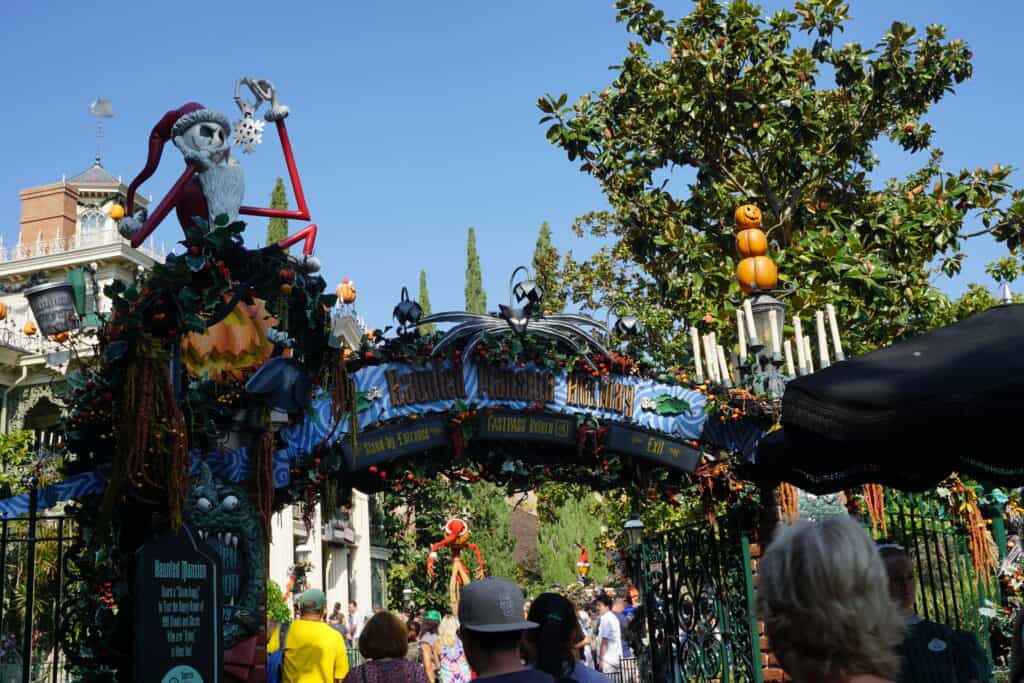 Nightmare Before Christmas decorations at entrance to Disneyland's Haunted Mansion during Halloween season.