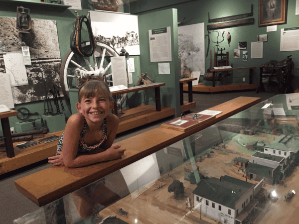 Young girl looking at display in Temecula Childrens Museum.