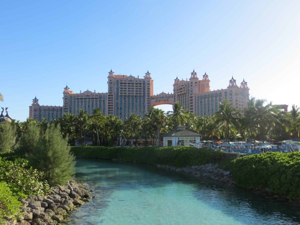 Waterway with trees and Royal Towers - Atlantis Bahamas in background.