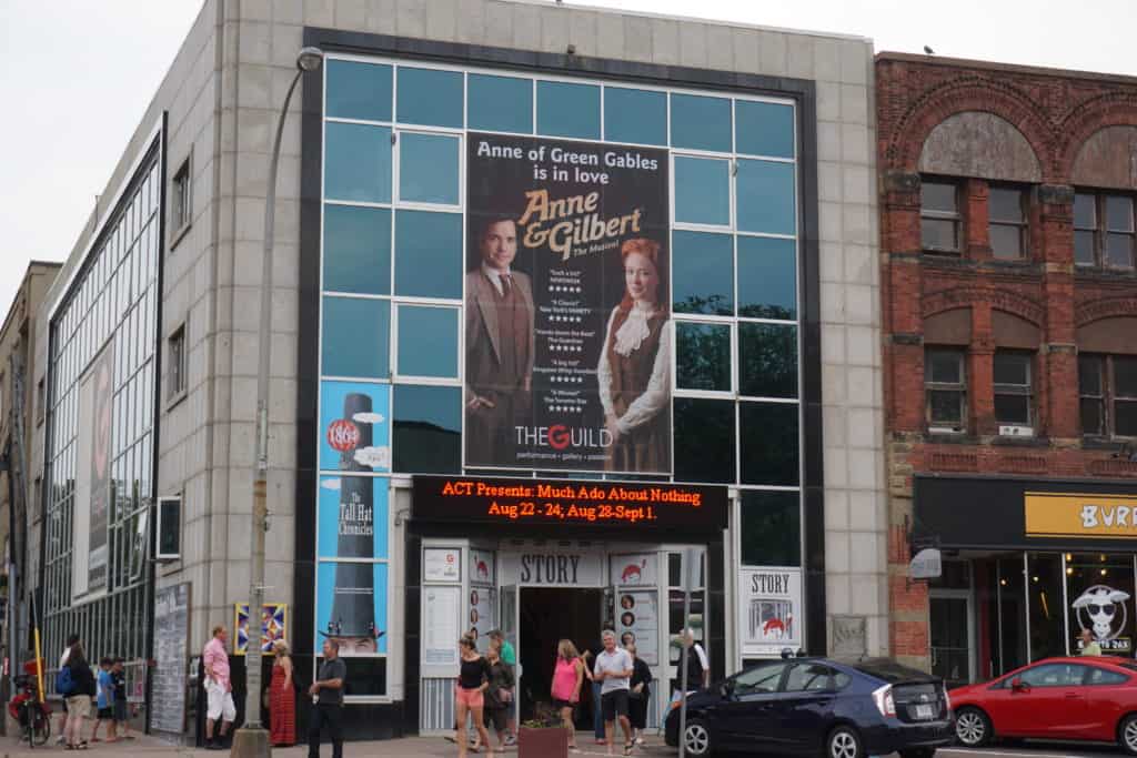 Exterior of The Guild theatre in Charlottetown, PEI with advertisement for Anne & Gilbert - The Musical.