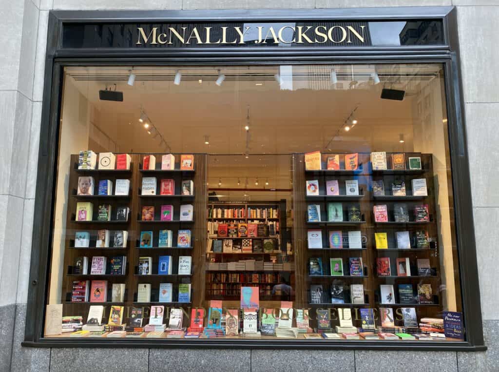Exterior view of window display of books at the McNally Jackson bookstore in Rockefeller Plaza.