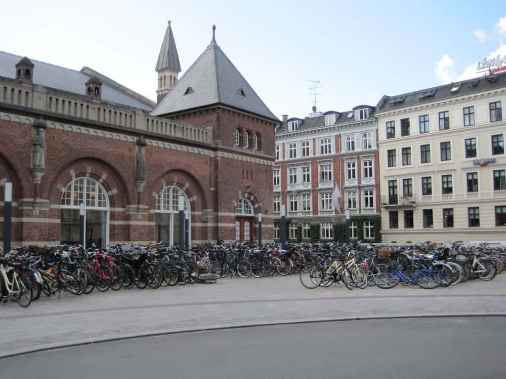 Racks of bicycles parked outside Central Station in Copenhagen, Denmark.