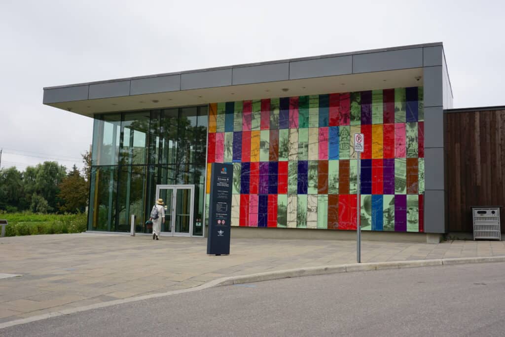 Exterior of Waterloo Regional Museum - modern building with glass and multicoloured panels on front face.