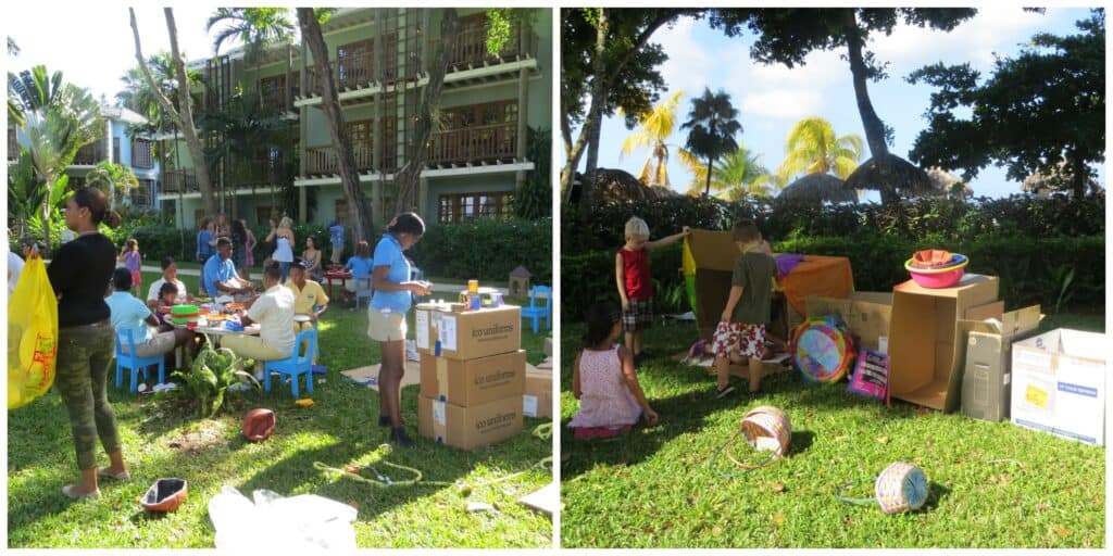 Beaches staff and kids playing with boxes and other objects on lawn at Beaches Negril.