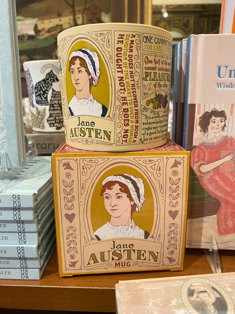 Literary display with Jane Austen mug with portrait and quotes sitting on top of the box.