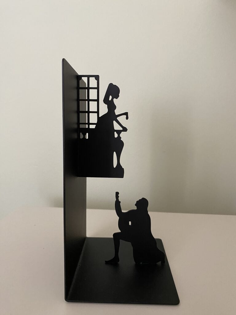 Black metal Romeo and Juliet bookends.