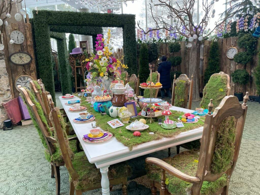 Whimsical tea table display - Alice in Bloomland at Royal Botanical Gardens.